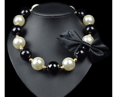 Beady Luxury Oversized Pearl Necklace with Black Bow Finish